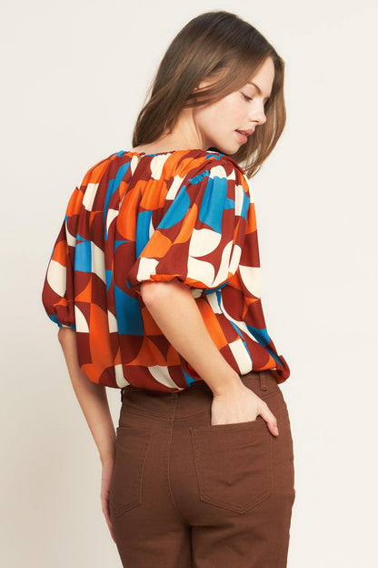 GONE IN A BLINK WOVEN TOP